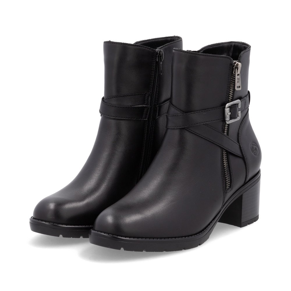 Black remonte women´s ankle boots D2A72-00 with decorative buckle as well as zipper. Shoes laterally.