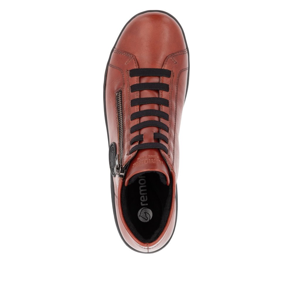 Chaussures à lacets remonte orange pour femme D1E70-38 avec logo noir. Chaussure vue de dessus.