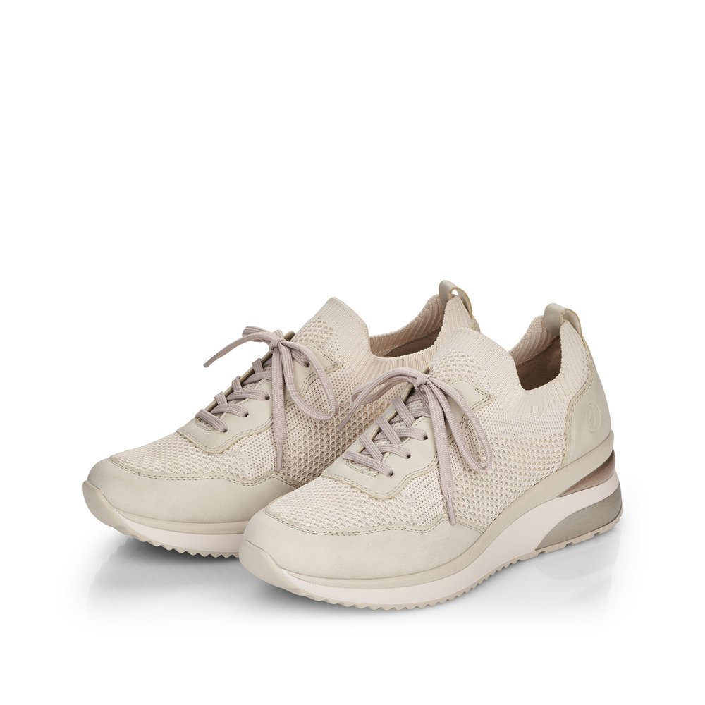 Cream beige remonte women´s sneakers D2406-60 with an elastic insert and mesh look. Shoes laterally.