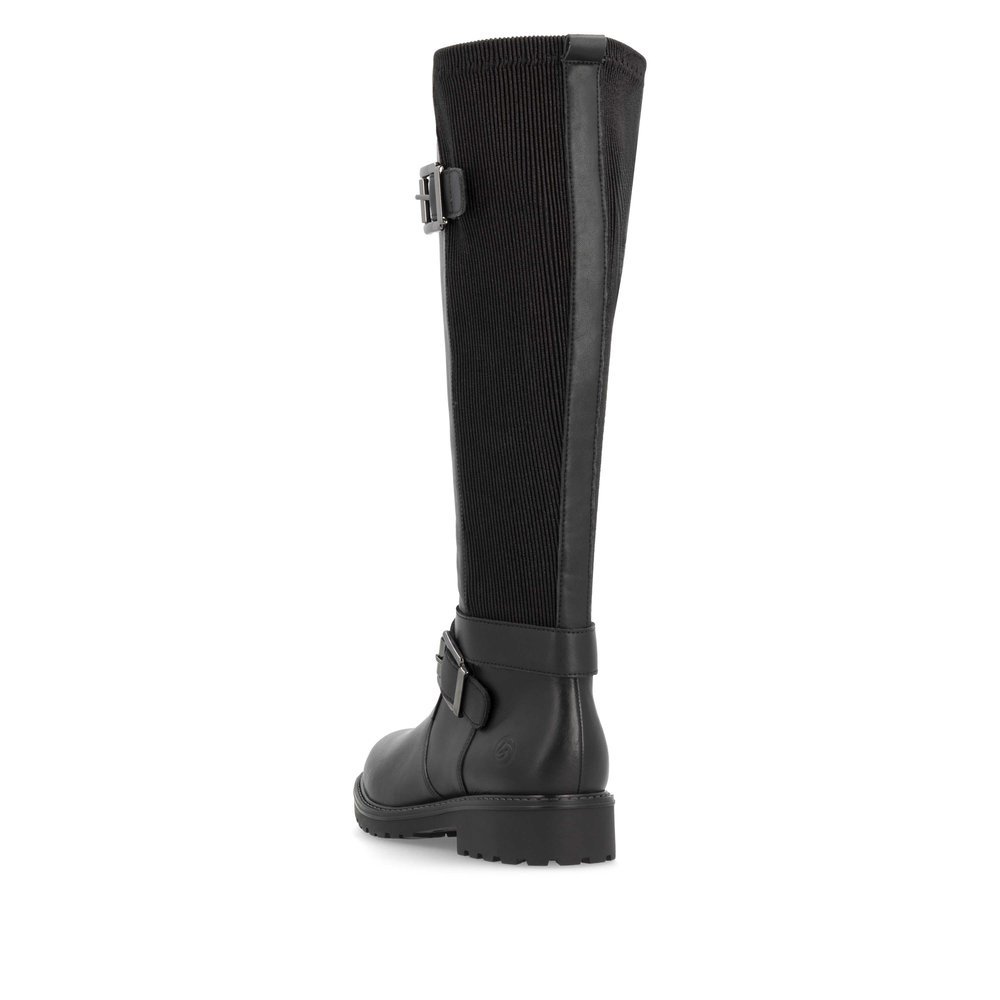 Black remonte women´s high boots R6593-00 with decorative buckles as well as zipper. Shoe from the back.