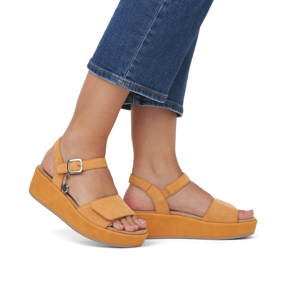 Orange remonte women´s strap sandals D1N50-38 with hook and loop fastener. Shoe on foot.