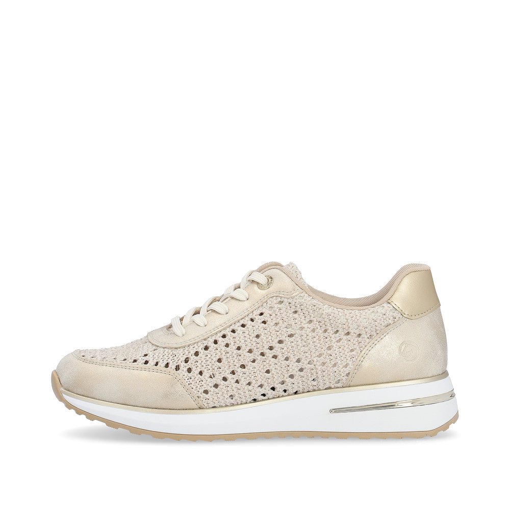 Beige remonte women´s sneakers D1G04-60 with a lacing and perforated look. Outside of the shoe.