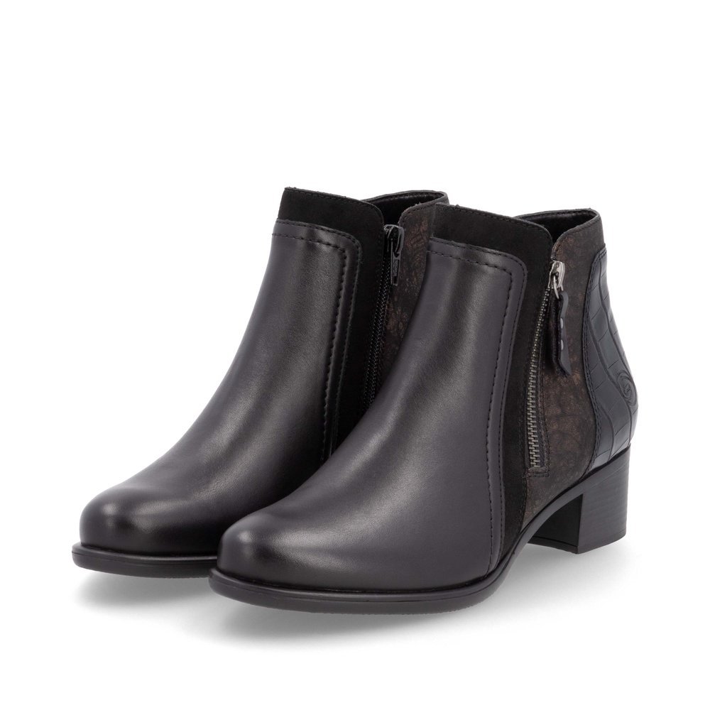 Bottines remonte noires pour femme R5172-04 avec fermeture éclair. Chaussures inclinées sur le côté.