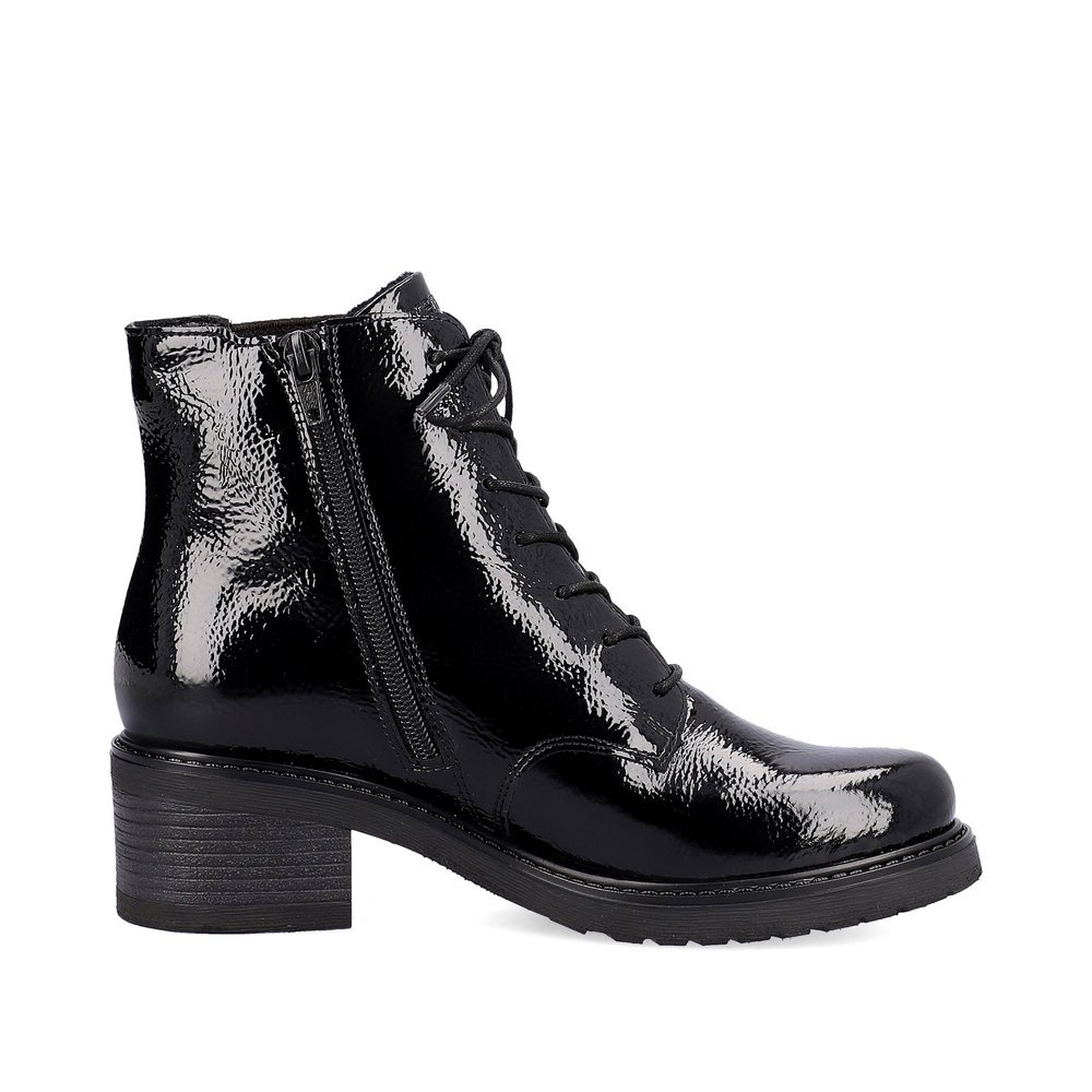 Glossy black remonte women´s biker boots D1A72-01 with a round decorative buckle. Shoe inside.