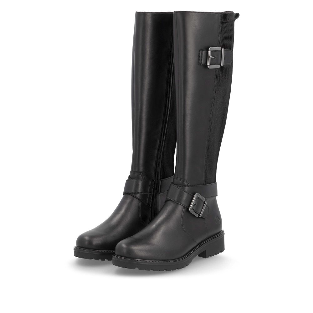 Black remonte women´s high boots R6593-00 with decorative buckles as well as zipper. Shoes laterally.