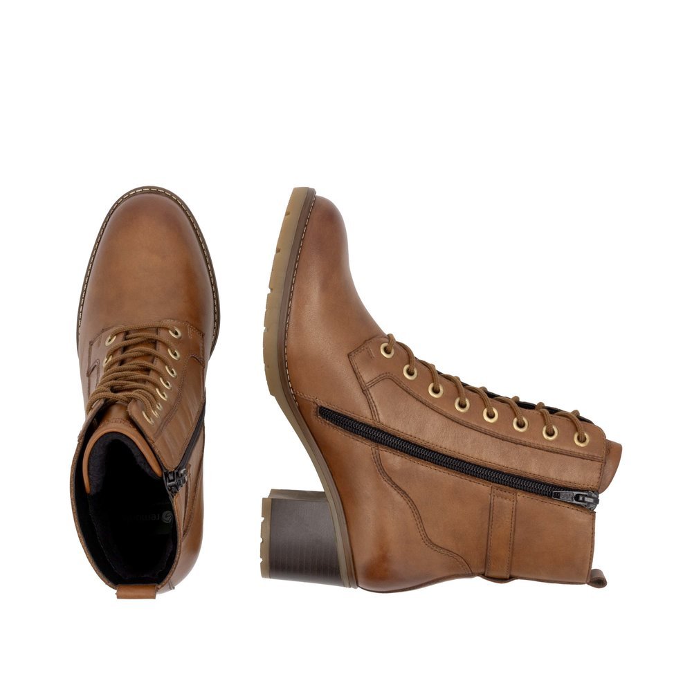 Brown remonte women´s ankle boots D2A74-24 with decorative buckle as well as zipper. Shoe from the top, lying.