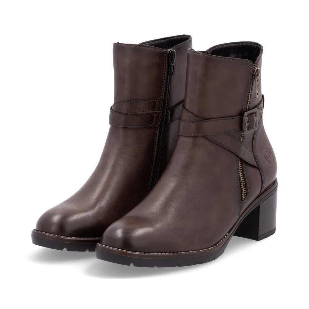 Brown remonte women´s ankle boots D2A72-25 with decorative buckle as well as zipper. Shoes laterally.