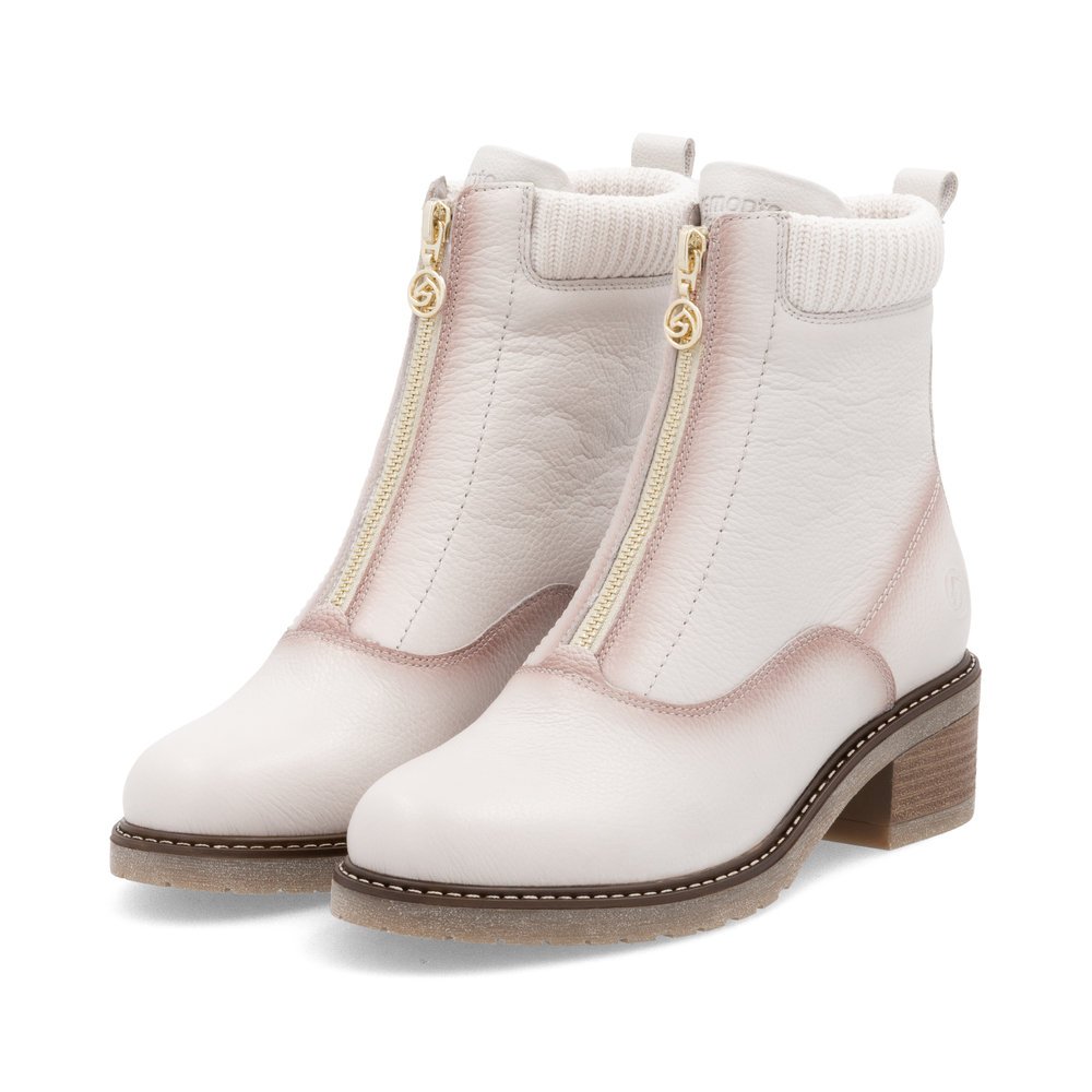 White remonte women´s ankle boots D1A80-80 with a zipper as well as a padded insole. Shoes laterally.