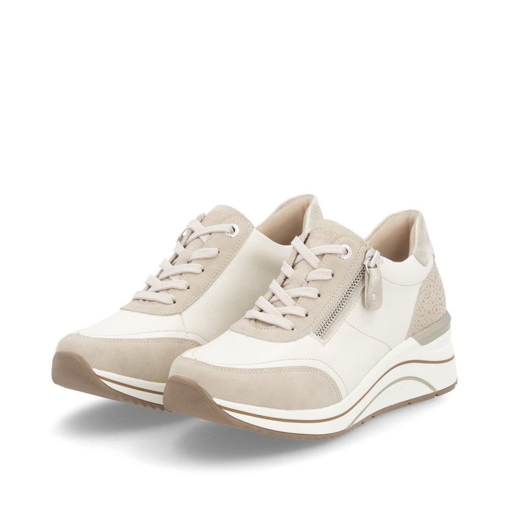 Beige remonte women´s sneakers D0T00-60 with a zipper as well as extra width H. Shoes laterally.