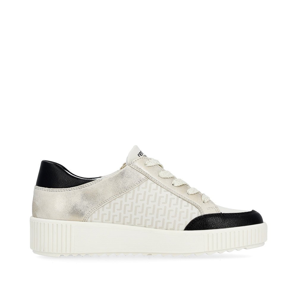 Cream white remonte women´s sneakers R7901-80 with a zipper and graphical pattern. Shoe inside.