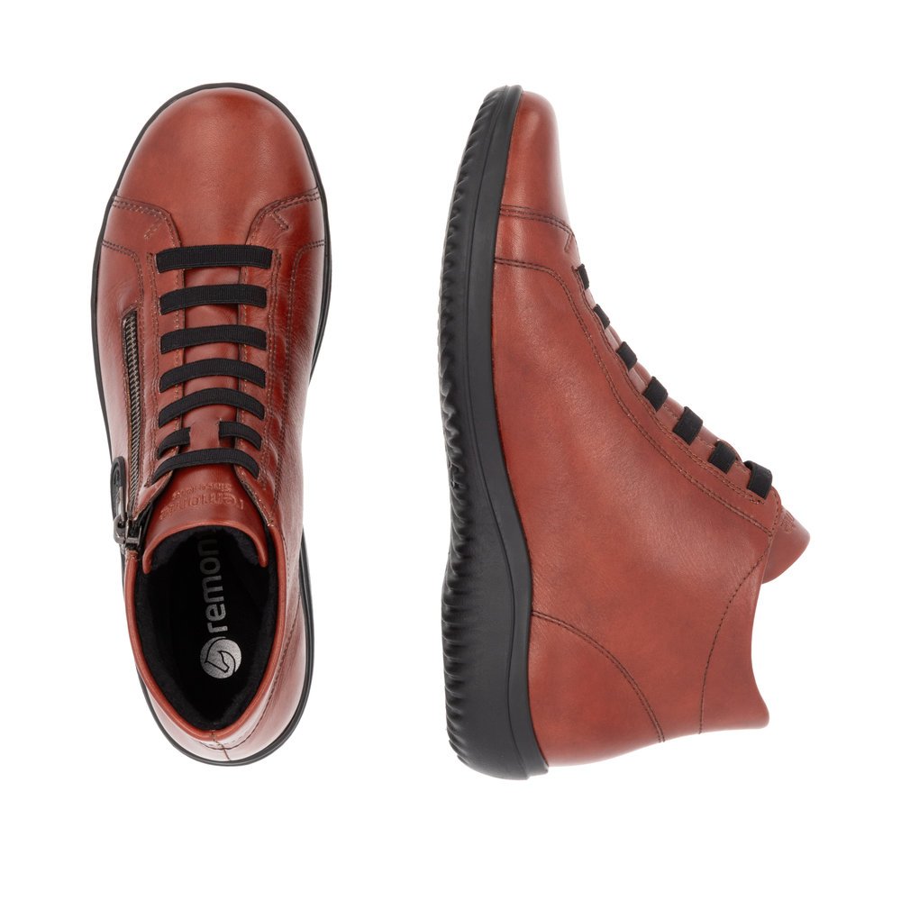 Chaussures à lacets remonte orange pour femme D1E70-38 avec logo noir. Chaussure vue de dessus, couchée.