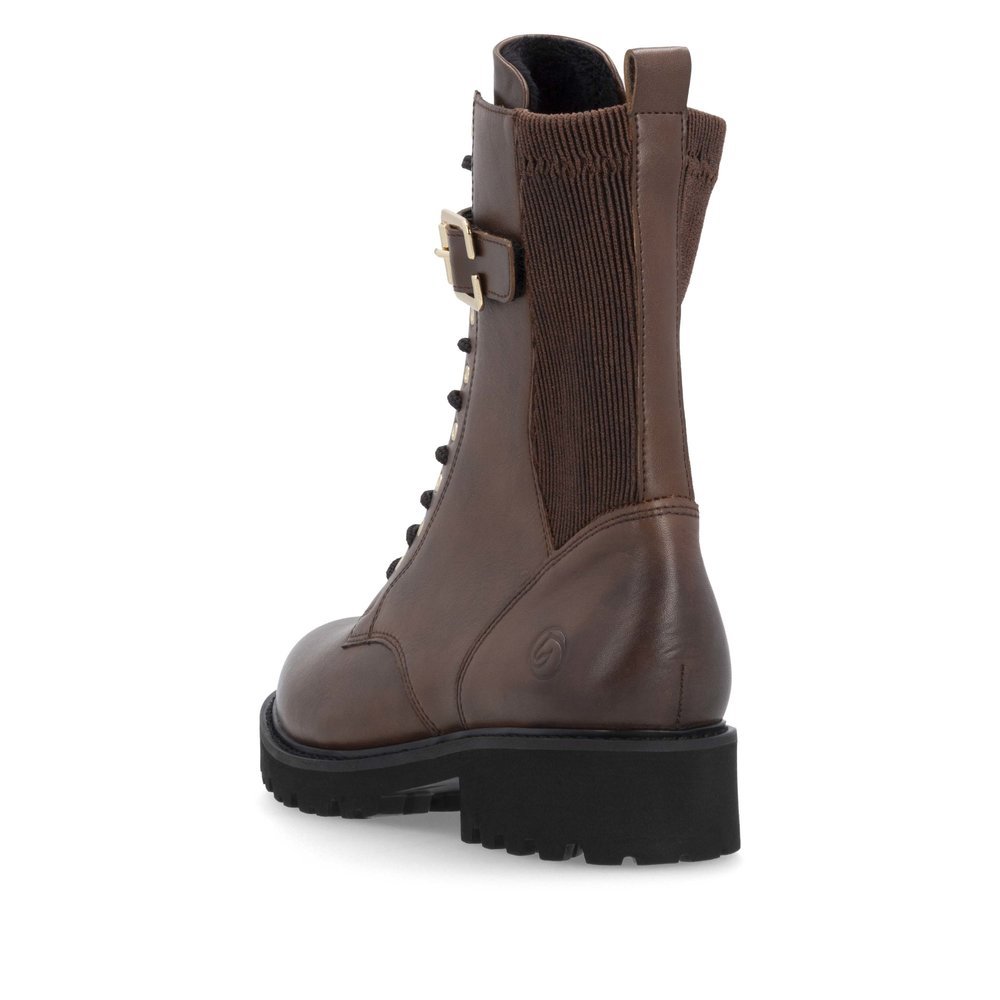 Brown remonte women´s biker boots D8664-25 with decorative buckle as well as zipper. Shoe from the back.