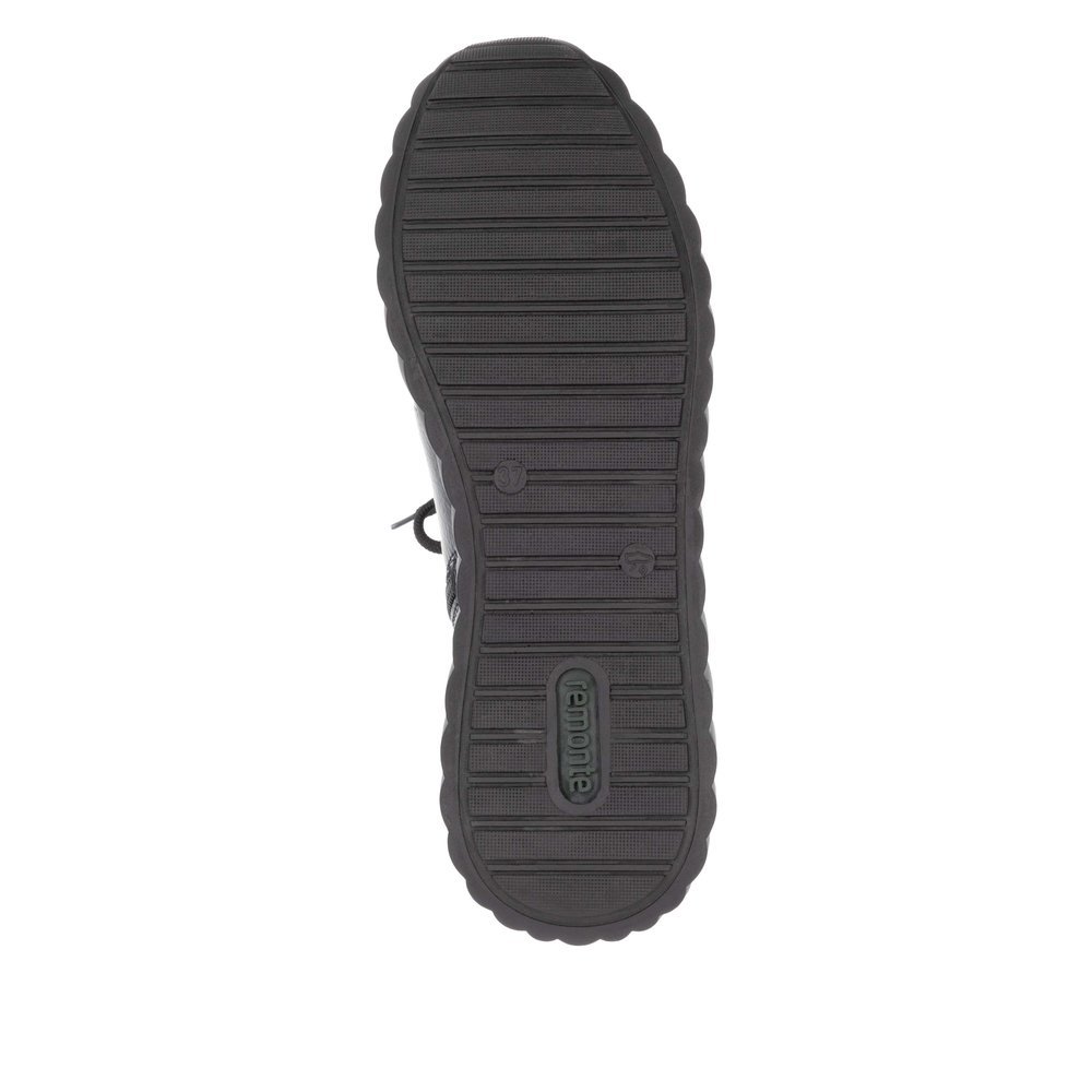 Black remonte women´s slippers D5977-00 with a zipper as well as a removable insole. Outsole of the shoe.