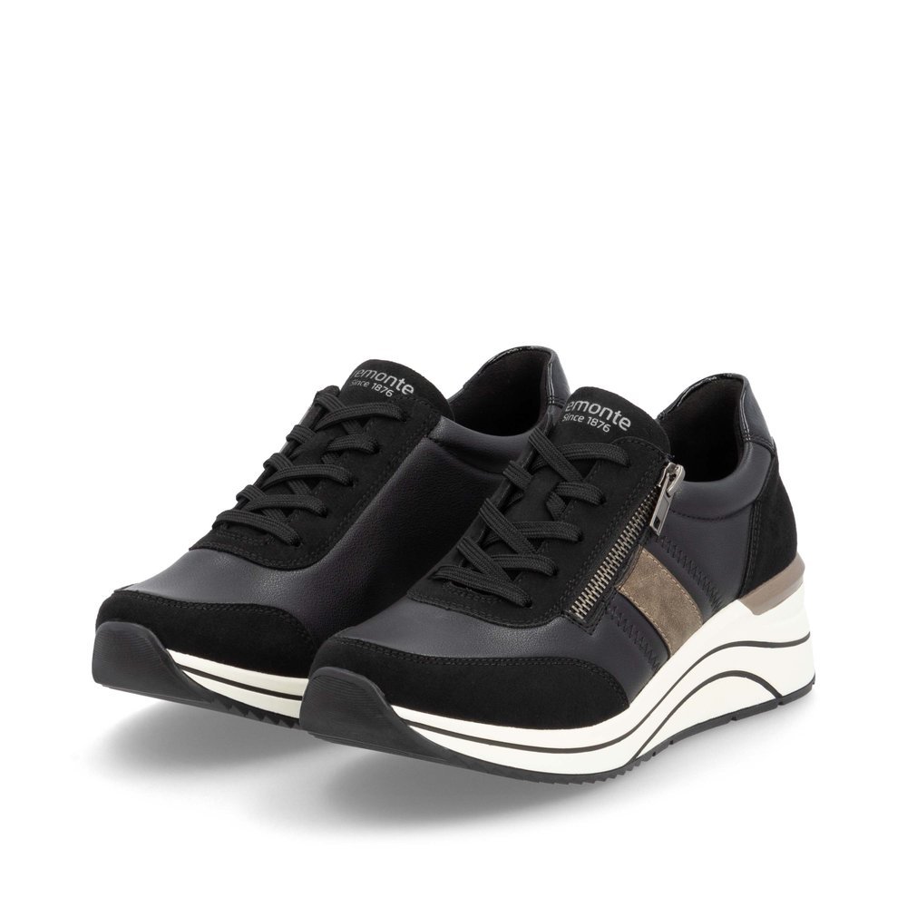 Black vegan remonte women´s sneakers D0T09-03 with zipper as well as extra width H. Shoes laterally.