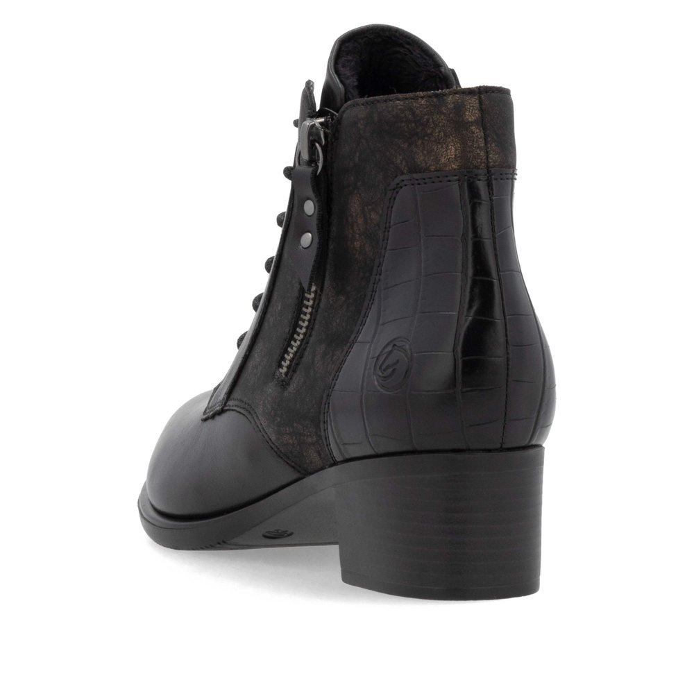 Bottines remonte noires pour femme R5187-03 avec fermeture éclair. Chaussure vue de l'arrière.