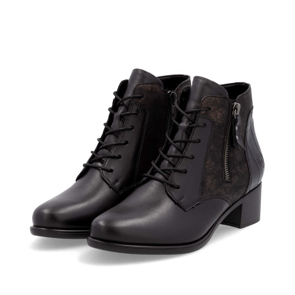 Bottines remonte noires pour femme R5187-03 avec fermeture éclair. Chaussures inclinées sur le côté.