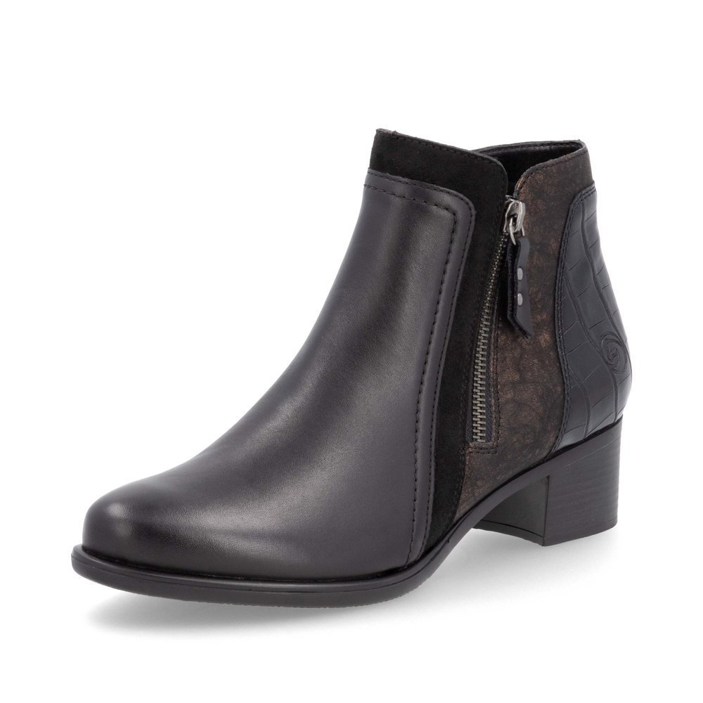 Bottines remonte noires pour femme R5172-04 avec fermeture éclair. Chaussure inclinée sur le côté.