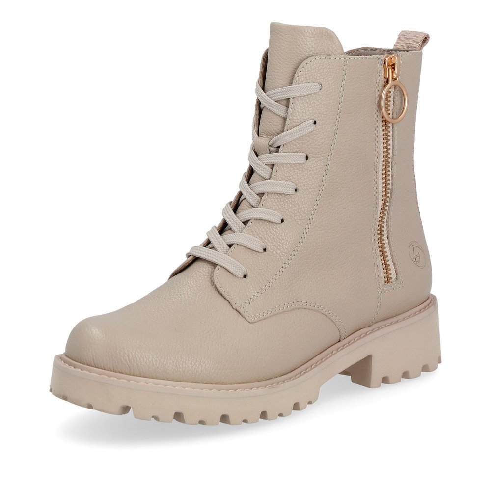 Weißbeige remonte Damen Schnürstiefel D8671-60 mit markanten Ösen. Schuh seitlich schräg.