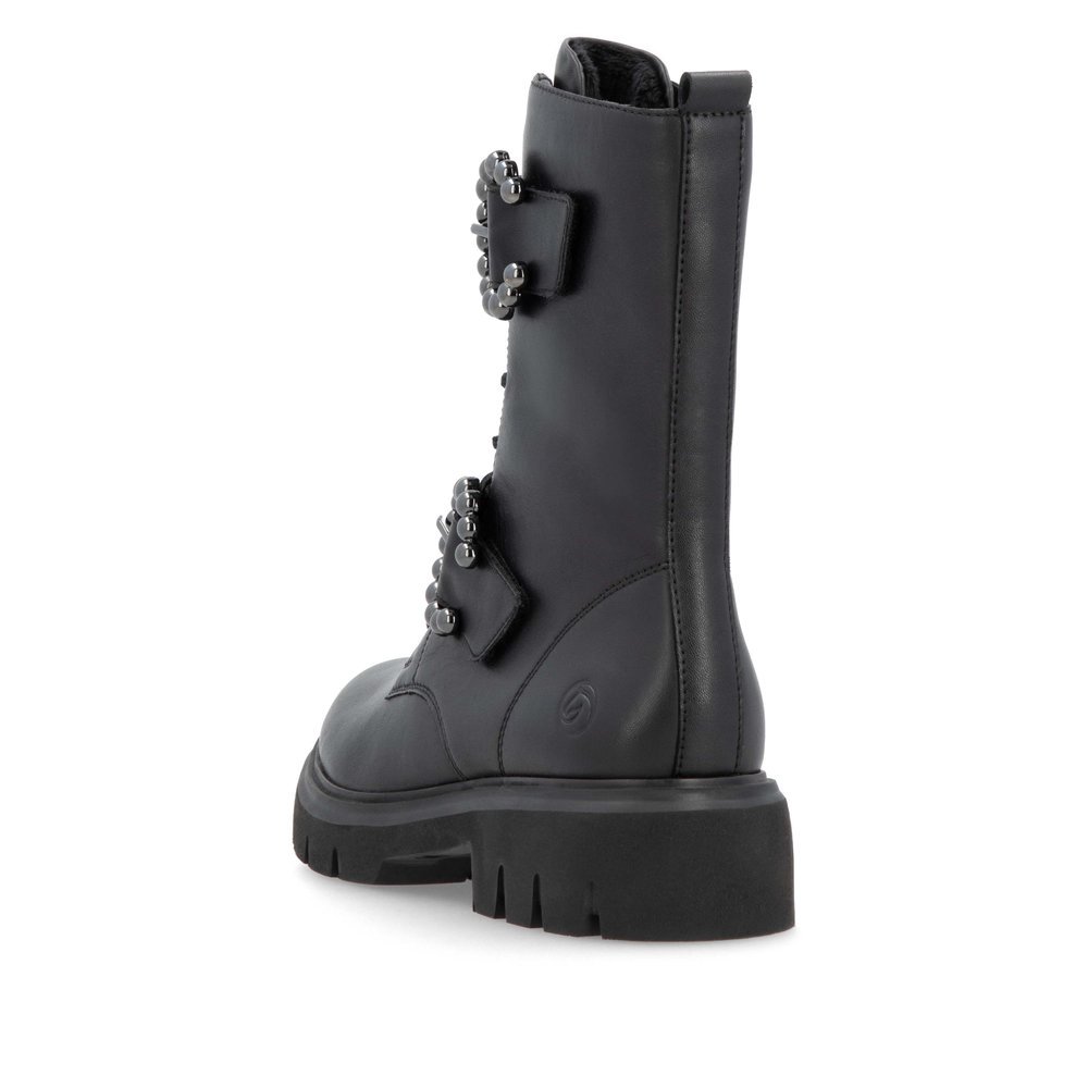 Jet black remonte women´s biker boots D1W70-00 with a round decorative buckles. Shoe from the back.