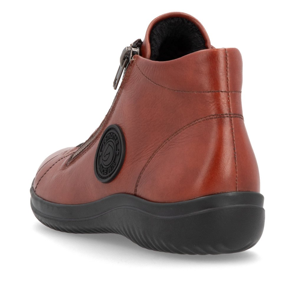 Chaussures à lacets remonte orange pour femme D1E70-38 avec logo noir. Chaussure vue de l'arrière.