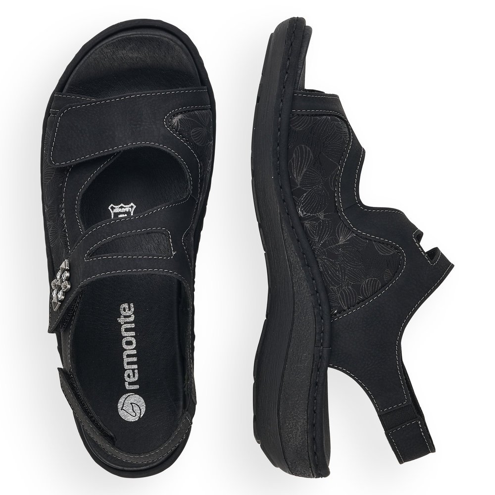 Black remonte women´s strap sandals D7647-01 with a hook and loop fastener. Shoe from the top, lying.