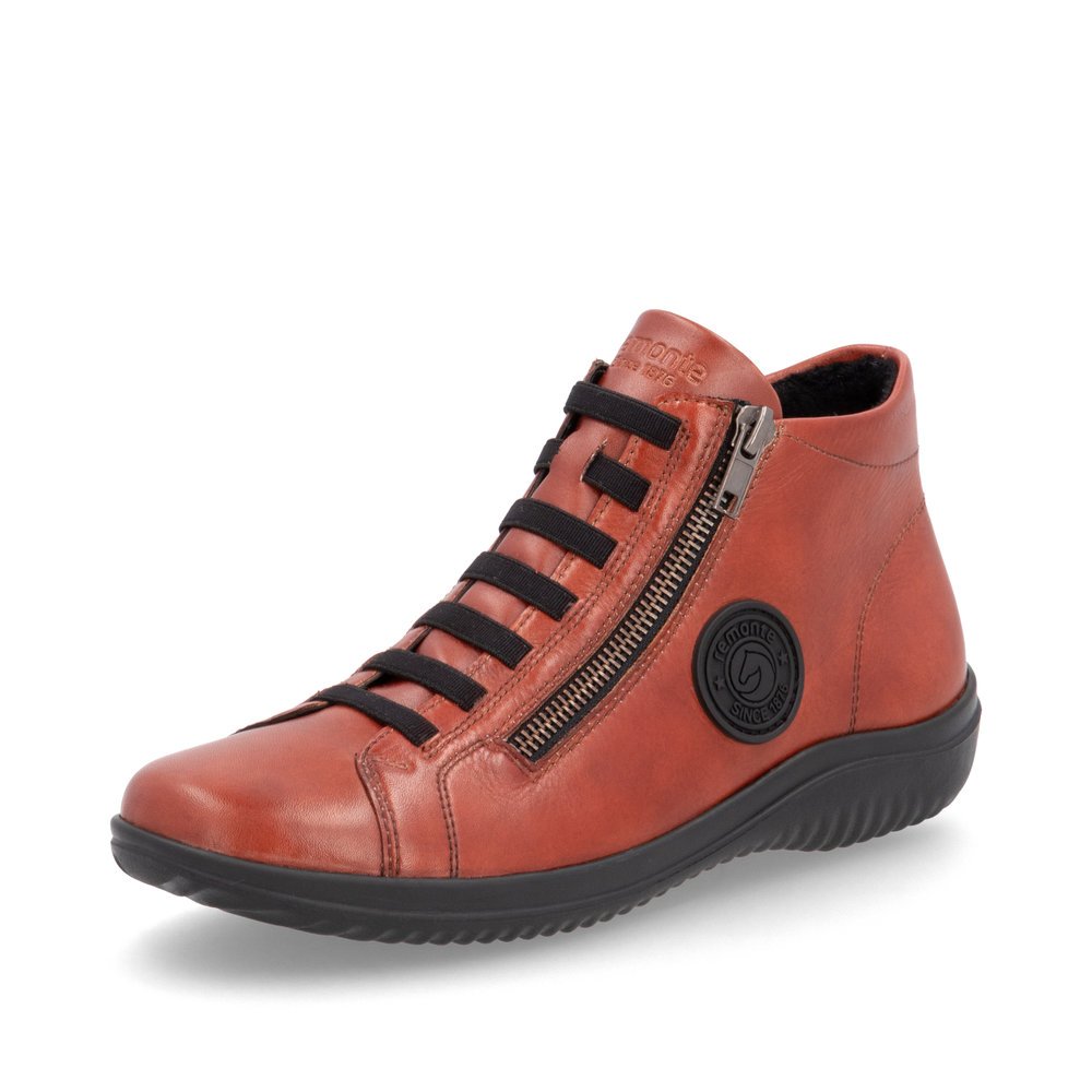 Chaussures à lacets remonte orange pour femme D1E70-38 avec logo noir. Chaussure inclinée sur le côté.