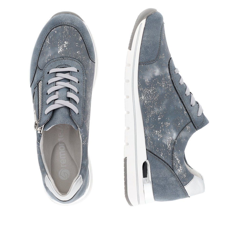 Blue remonte women´s sneakers R6700-13 with zipper and washed-out pattern. Shoe from the top, lying.