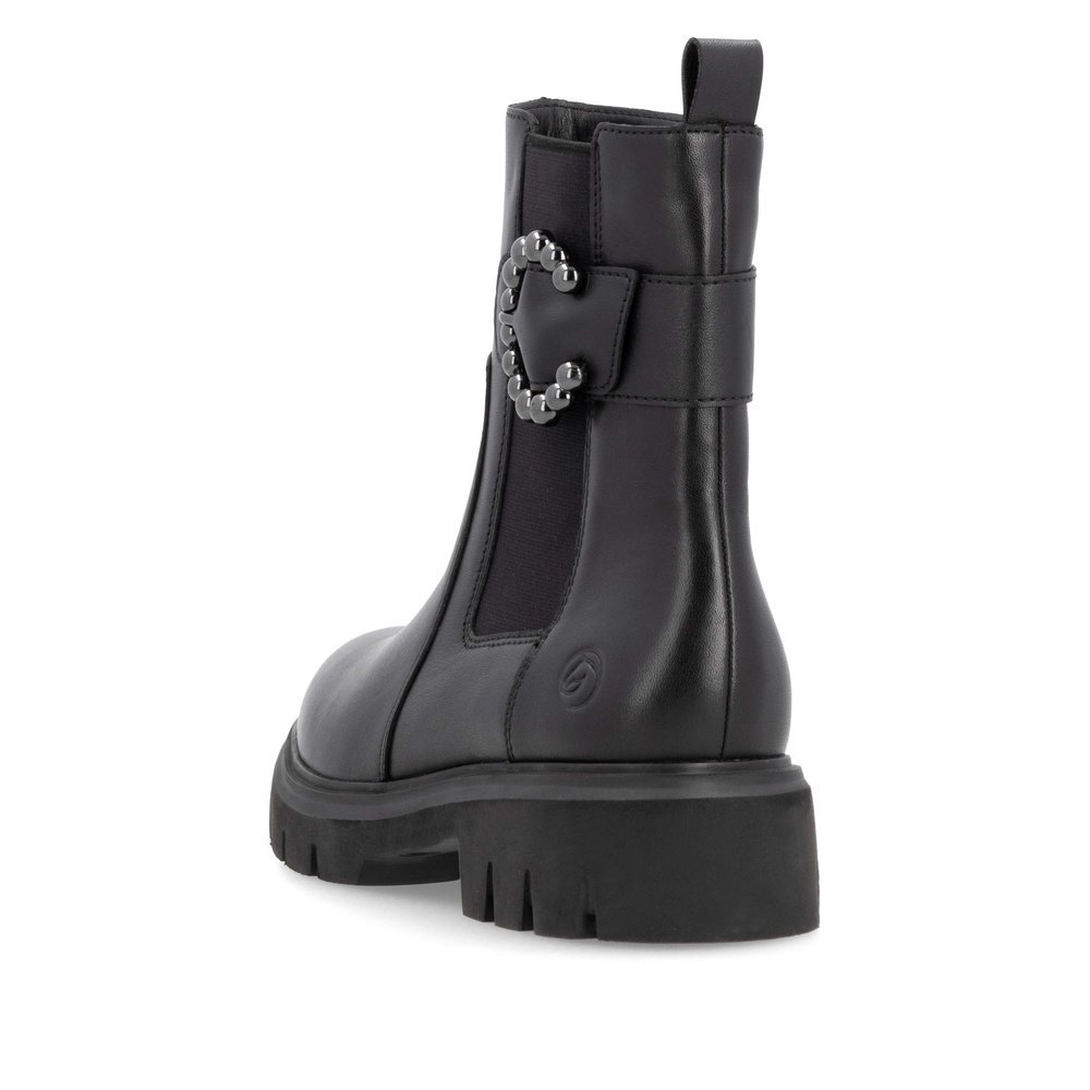 Jet black remonte women´s Chelsea boots D1W74-00 with a round decorative buckle. Shoe from the back.