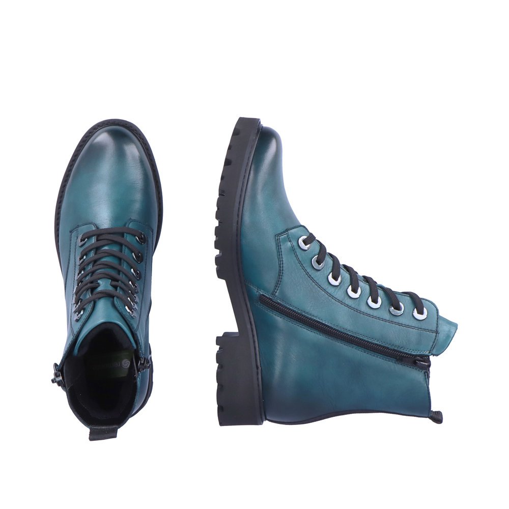 Blue remonte women´s biker boots D8671-12 with a distinctive eyelets. Shoe from the top, lying.