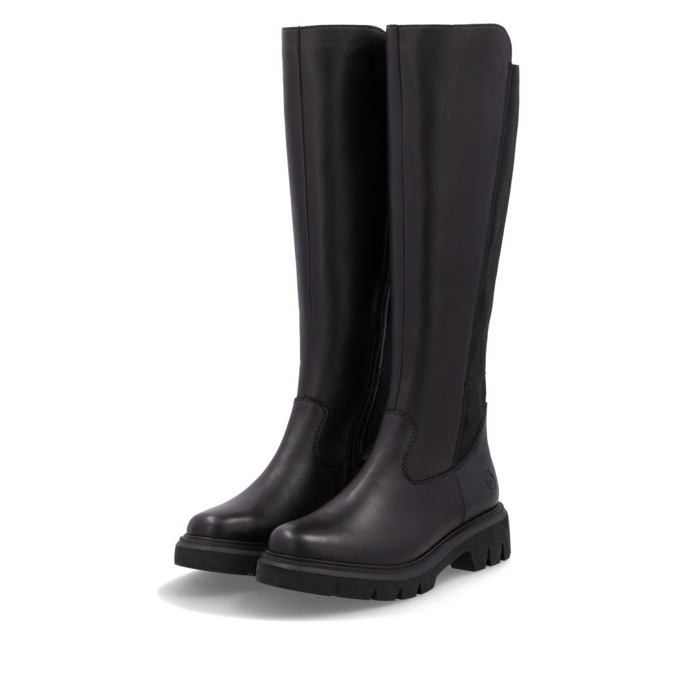 Bottes à tige haute remonte noires femme D1W77-00 avec fermeture éclair. Chaussures inclinées sur le côté.