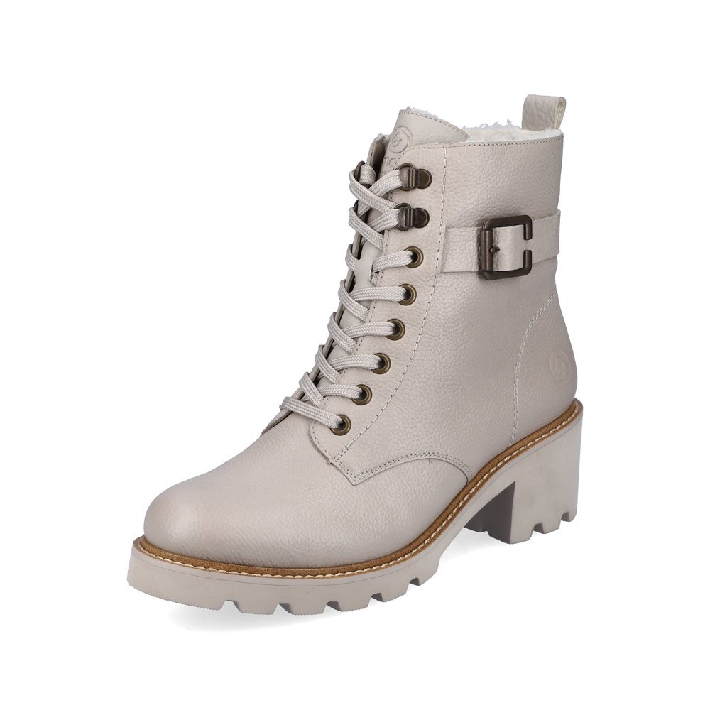 Beige remonte women´s biker boots D0A74-60 with decorative buckle as well as zipper. Shoe laterally.