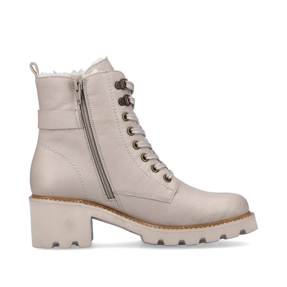 Beige remonte women´s biker boots D0A74-60 with decorative buckle as well as zipper. Shoe inside.