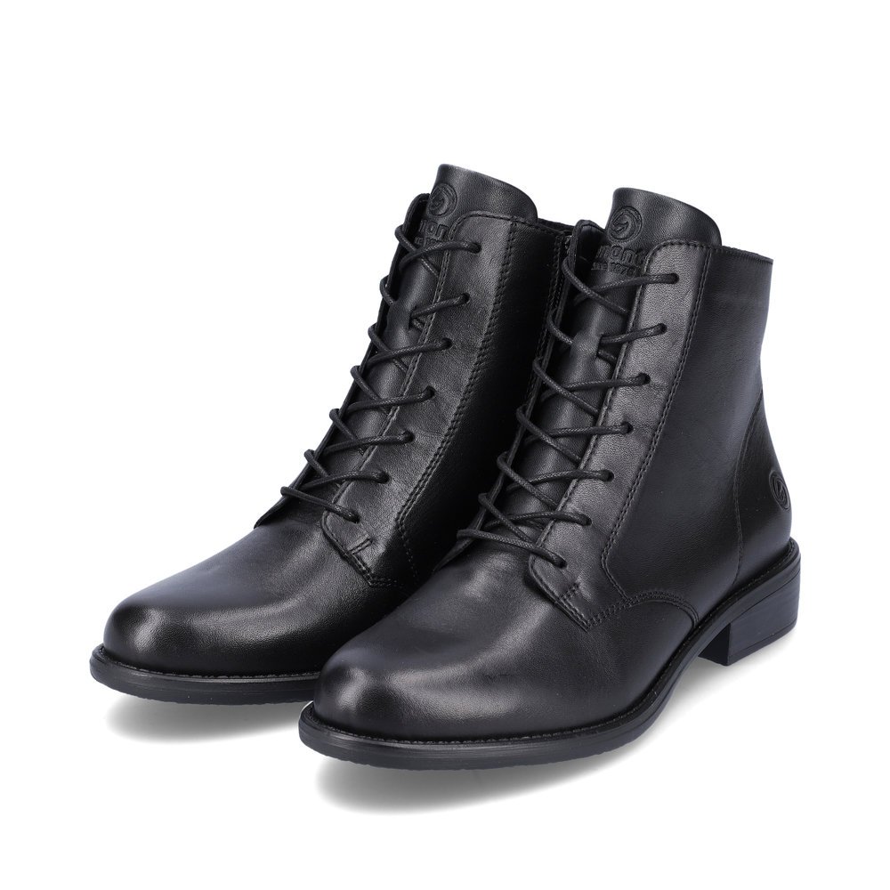 Bottines remonte noires pour femme D0F73-01 avec fermeture éclair. Chaussures inclinées sur le côté.