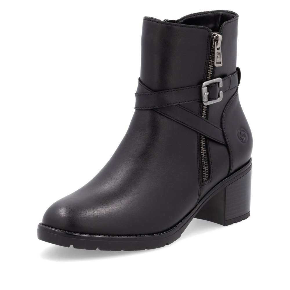 Black remonte women´s ankle boots D2A72-00 with decorative buckle as well as zipper. Shoe laterally.