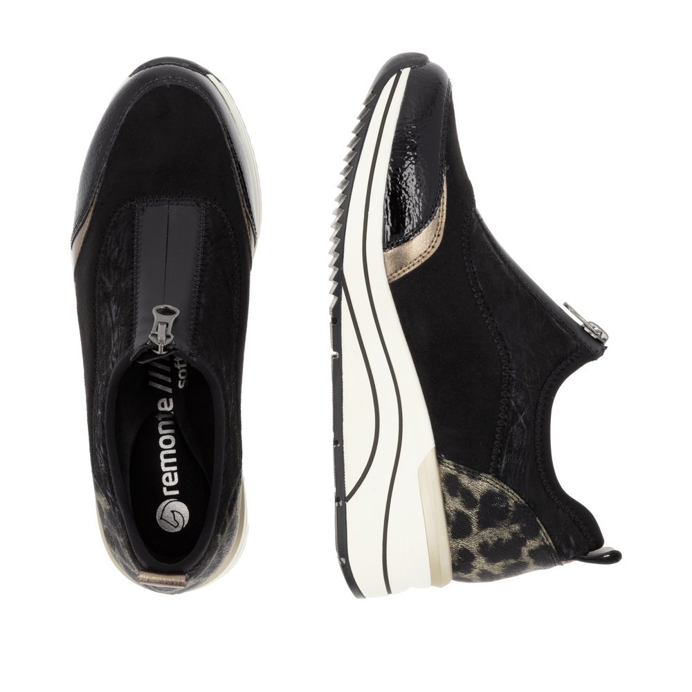 Black vegan remonte women´s sneakers D0T08-02 with animal print as well as a zipper. Shoe from the top, lying.