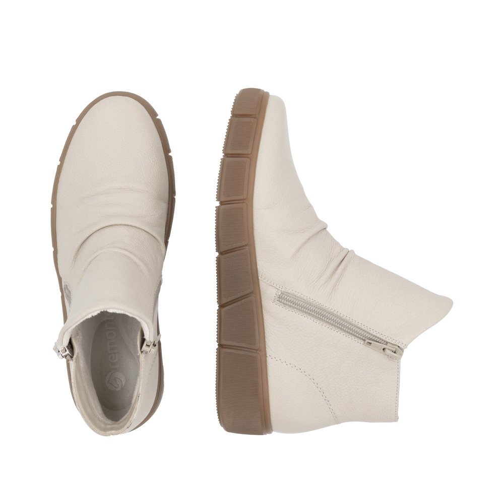 Cream beige remonte women´s ankle boots D1T73-60 with remonteTEX technology. Shoe from the top, lying.