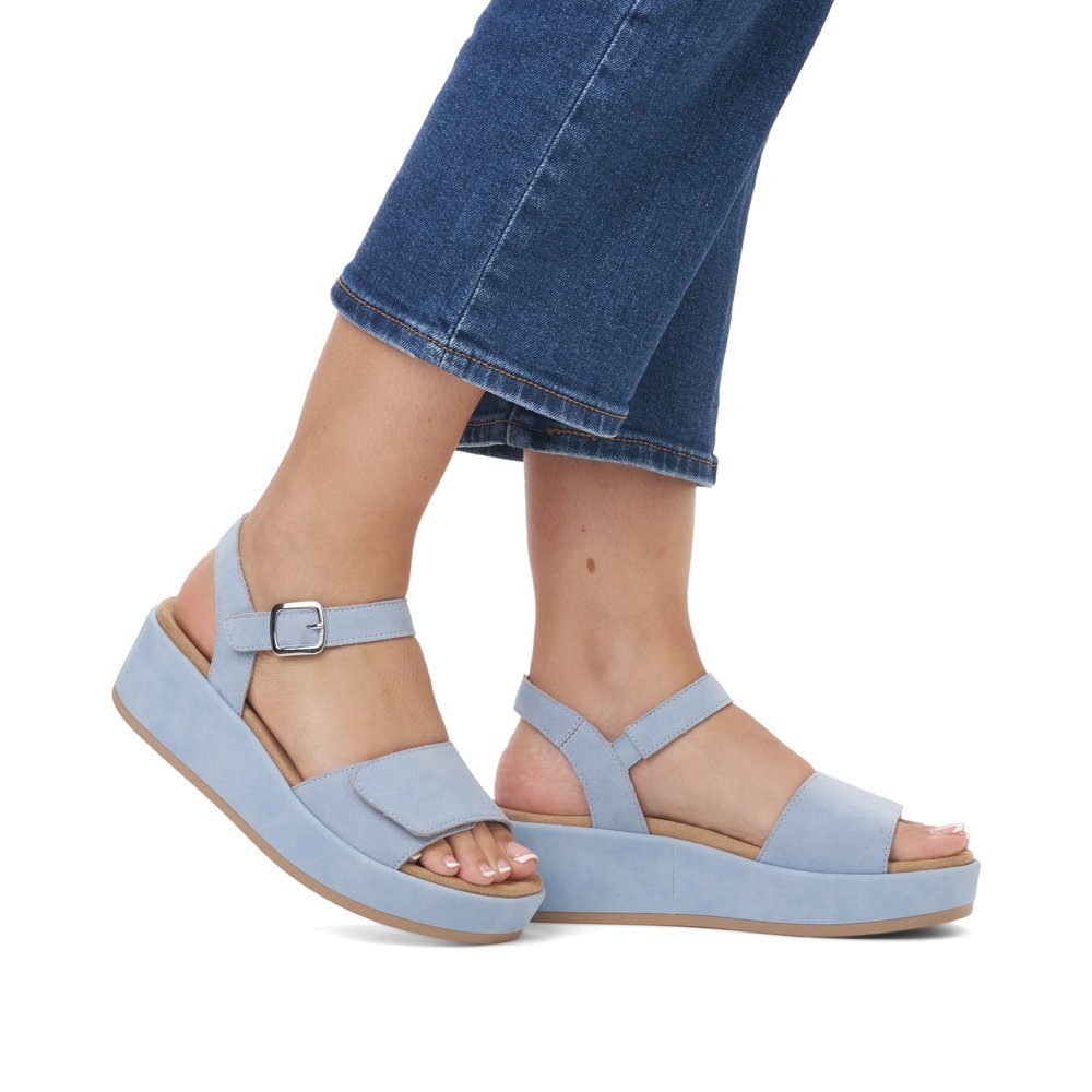 Ice blue remonte women´s strap sandals D1N50-10 with hook and loop fastener. Shoe on foot.