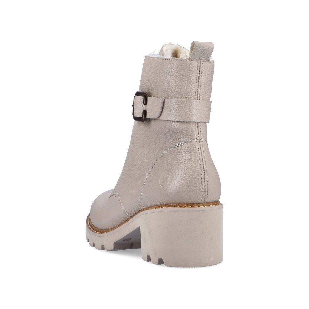 Beige remonte women´s biker boots D0A74-60 with decorative buckle as well as zipper. Shoe from the back.