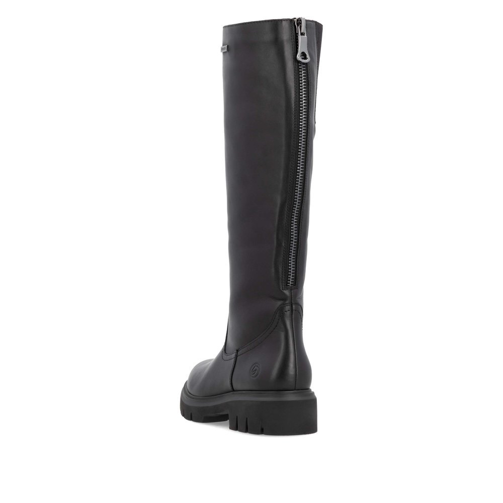 Black remonte women´s high boots D1W73-00 with a zipper as well as comfort width G. Shoe from the back.