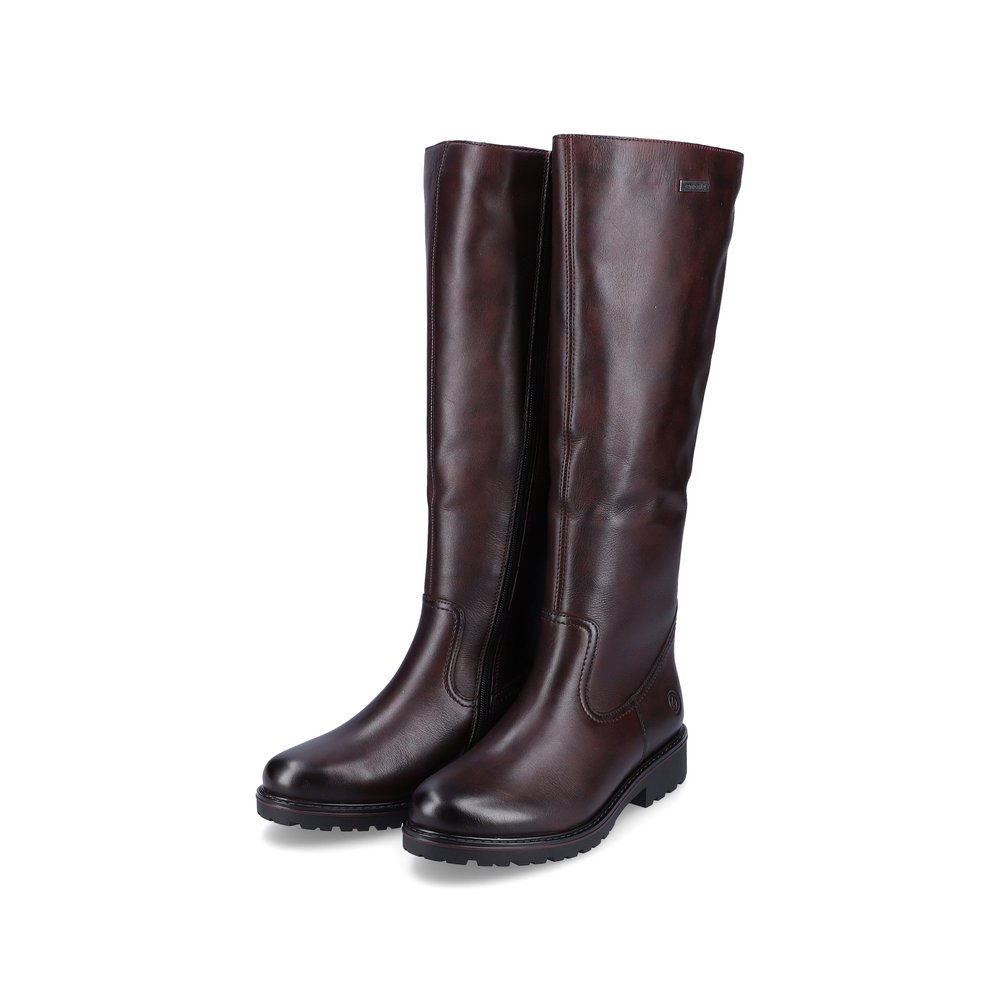 Bottes à tige haute remonte rouges femme R6576-35 avec fermeture éclair. Chaussures inclinées sur le côté.