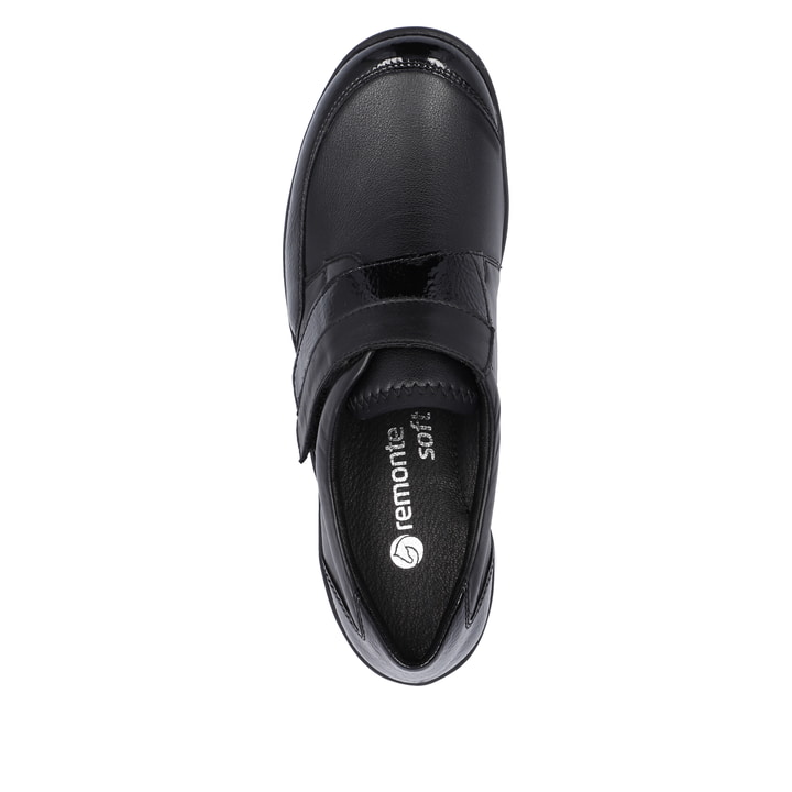 Mocassins remonte noirs pour femme R7600-04 avec fermeture velcro. Semelle extérieure de la chaussure.