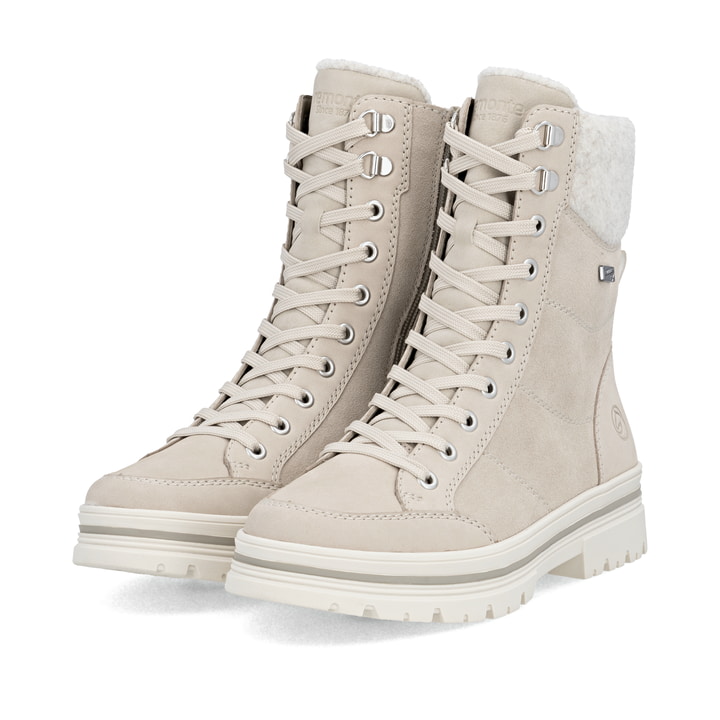 Beige remonte Damen Schnürstiefel D2U70-62 mit griffiger Glass-Fibre Sohle. Schuhpaar seitlich schräg.
