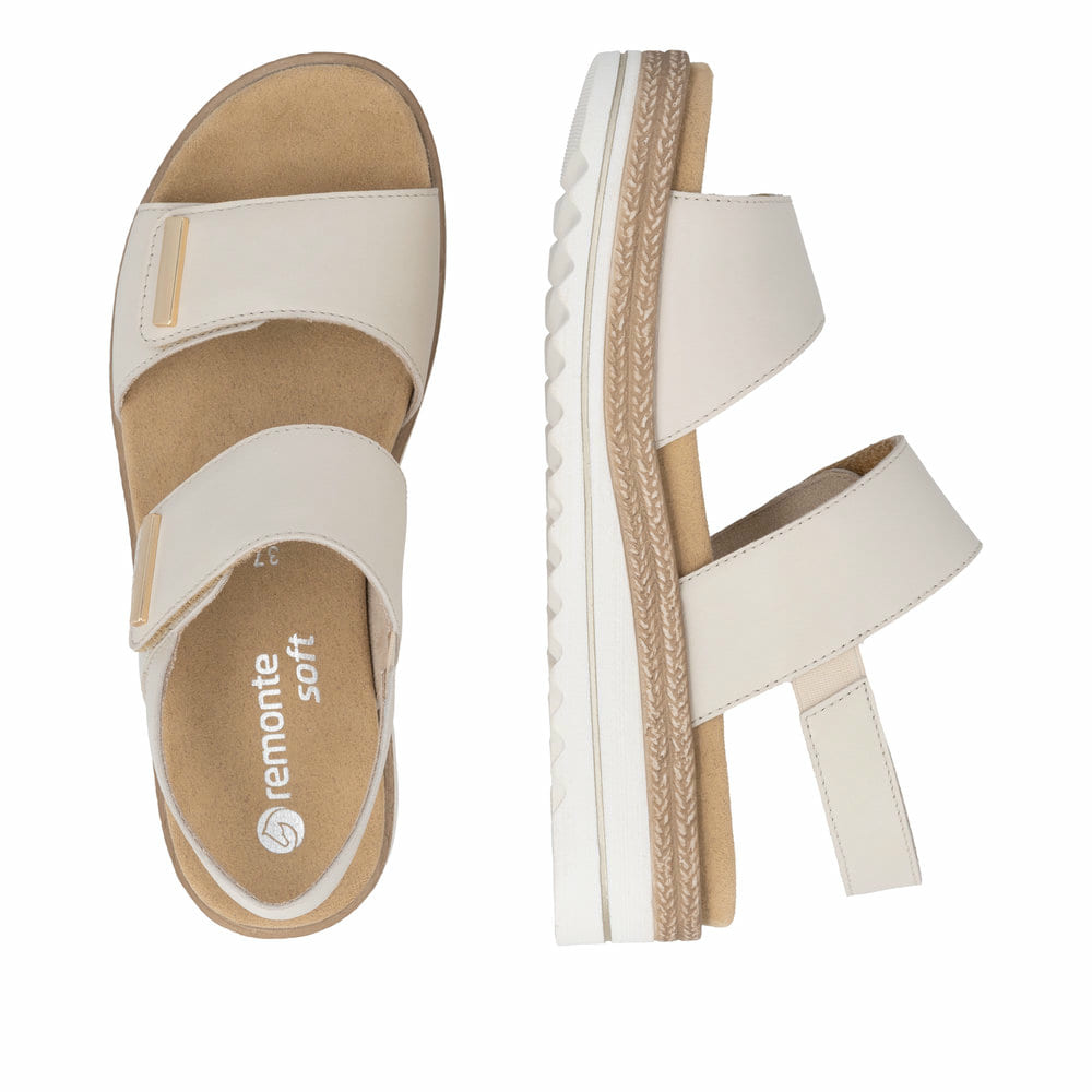 Beige remonte Keilsandaletten D0Q59-61 mit einem Klettverschluss. Schuh von oben, liegend.