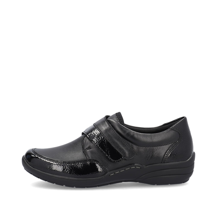 Mocassins remonte noirs pour femme R7600-04 avec fermeture velcro. Côté extérieur de la chaussure.
