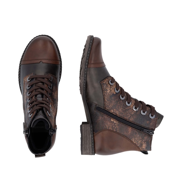Dunkelbraun-bronzene remonte Damen Stiefeletten D4382-25 mit auffälligem Muster. Schuh von oben, liegend.
