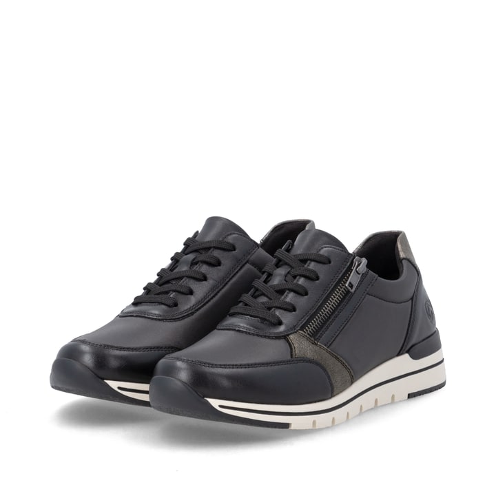 Baskets basses remonte noires pour femmes R6700-04 avec fermeture éclair. Chaussures inclinées sur le côté.