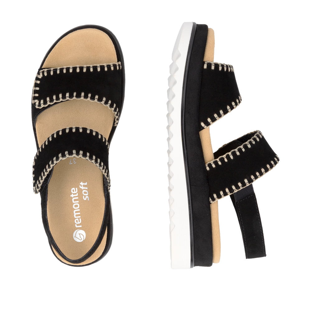 Schwarze remonte Riemchensandalen D3P50-02 mit handgestickten Nähten. Schuh von oben, liegend.
