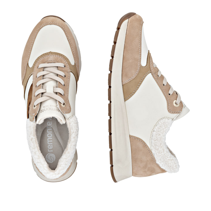 Beige remonte Damen Sneaker D2G07-60 mit flauschigem Schaftrand sowie Schnürung. Schuh von oben, liegend.