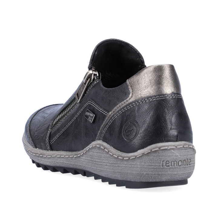 
Graphitschwarze remonte Damen Slipper R1428-03 mit einer dämpfenden Profilsohle. Schuh von hinten