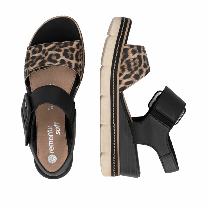 Schwarze remonte Keilsandaletten D2L53-03 mit angesagtem Animal-Print. Schuh von oben, liegend.